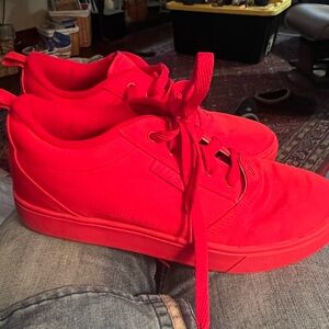 This is a Heelys Pro 20 red canvas skate shoe. Size 9